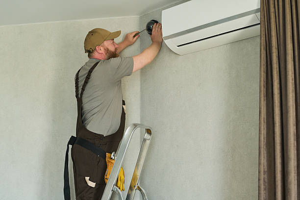 istock Caucasian Middle Aged Man Installing Security Camera near Air Conditioner 2231361449