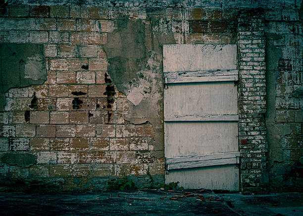 istock boarded up door alley 2231366726