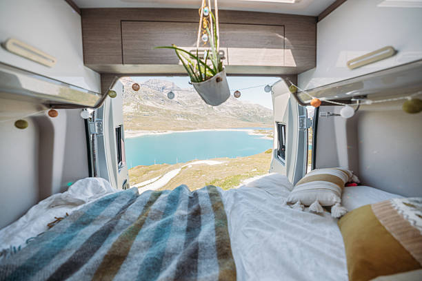 istock Cozy Camper Van Bed Overlooking Mountain Lake 2231369313