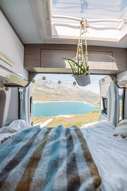 istock Cozy Camper Van Bed Overlooking Mountain Lake 2231369851