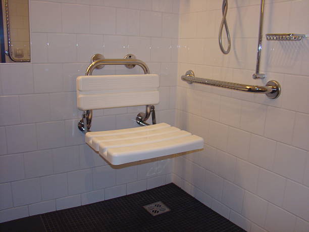 istock Accessible shower with folding seat and grab bars for convenience and safety 2231370175