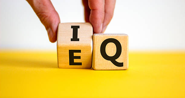 istock IQ or EQ symbol. Psychologist flips a cube, changes words IQ, intelligence quotient to EQ, emotional quotient. Beautiful white background. Concept of emotional and intelligence quotient. Copy space. 2231374054
