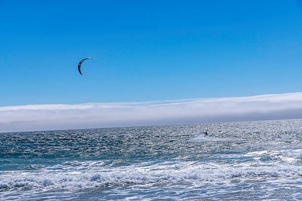Lompoc, CA, USA  August 13, 2025: Kitesurfers take advantage of the high winds on the Pacific Ocean at Jalama Beach in Lompoc, CA.