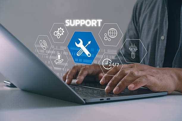 istock Close-up of hands typing on laptop with virtual support icons, AI tools, chatbot and 24/7 service. Concept of customer support, digital technical assistance and remote help via modern technology. 2231376877