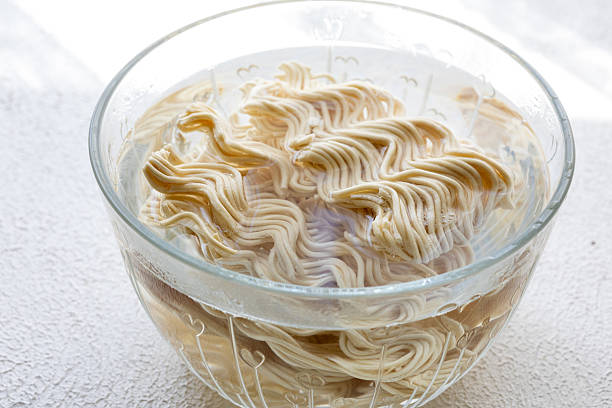 ramen soup noodles with tomato sauce in a bowl
