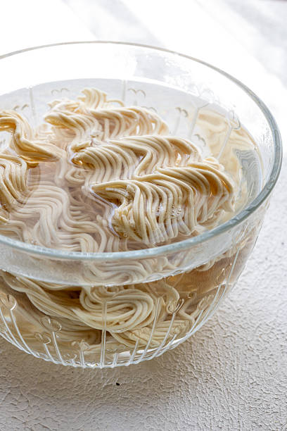ramen soup noodles with tomato sauce in a bowl