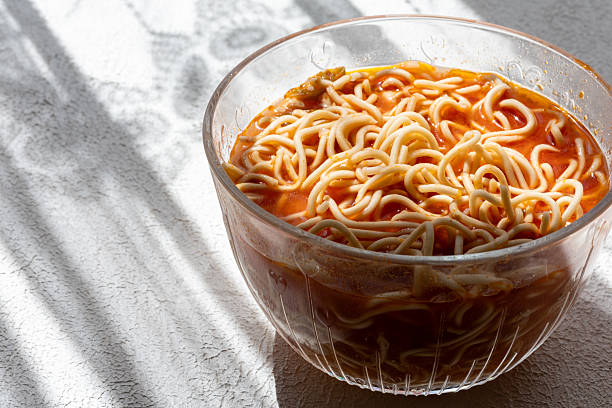 ramen soup noodles with tomato sauce in a bowl
