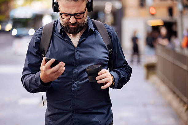 istock Smart casual man with cellphone 2231377606