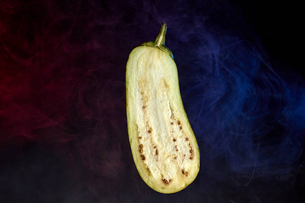 istock Sliced eggplant vegetable half isolated against dark background 2231379467