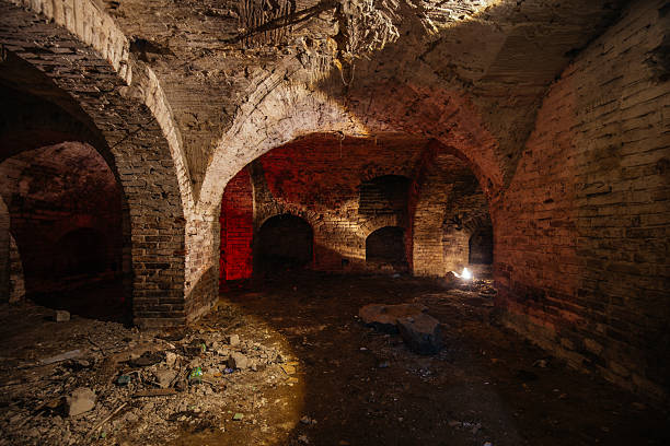 istock Dark and creepy vaulted red brick dungeon 2231381589