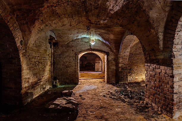 istock Dark and creepy vaulted red brick dungeon 2231381613