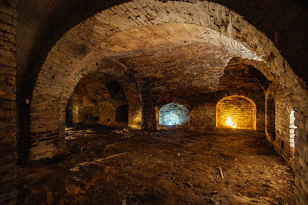 istock Dark and creepy vaulted red brick dungeon 2231381616