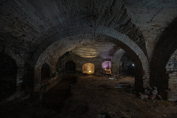 istock Dark and creepy vaulted red brick dungeon 2231381618