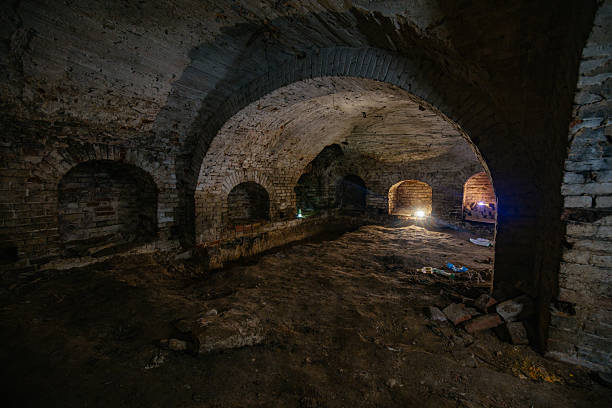 istock Dark and creepy vaulted red brick dungeon 2231381630