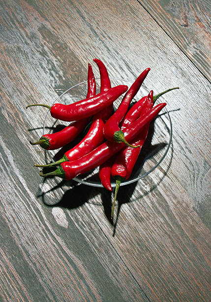 Red jalapeno peppers isolated on a white background.