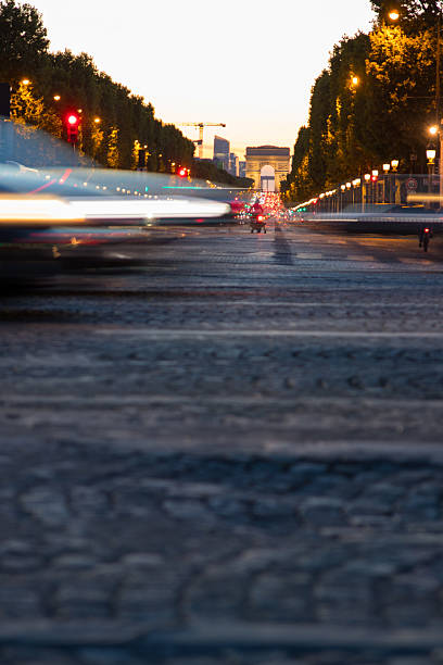 istock night traffic in the city in front of eiffel tower 2231385117