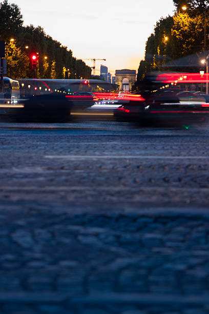 night traffic in the city in front of eiffel tower