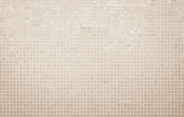 istock Cream light ceramic wall and floor tiles mosaic background in bathroom and kitchen. Design pattern geometric with grid wallpaper texture decoration pool. Simple seamless abstract surface clean. 2231399887