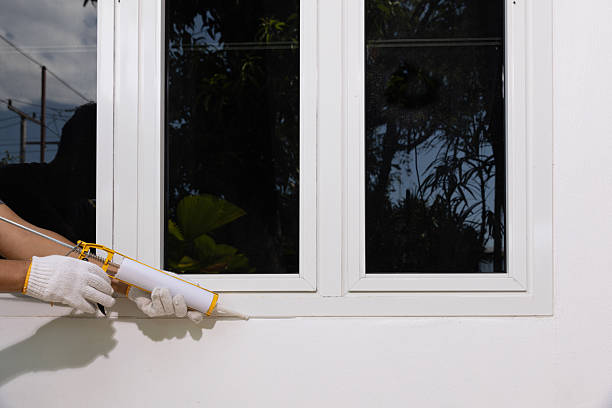 istock Handyman using acrylic sealant caulk the outside window frame. 2231403748
