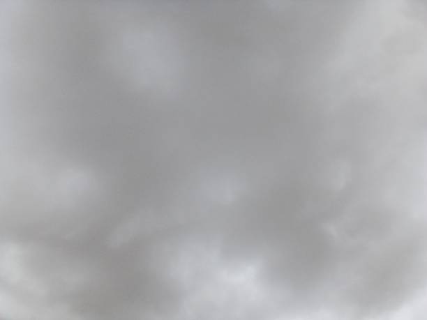 sky full of thick white and gray clouds, copy space