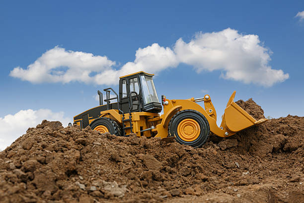 istock Wheel loader are digging the soil in the construction site . 2231406600