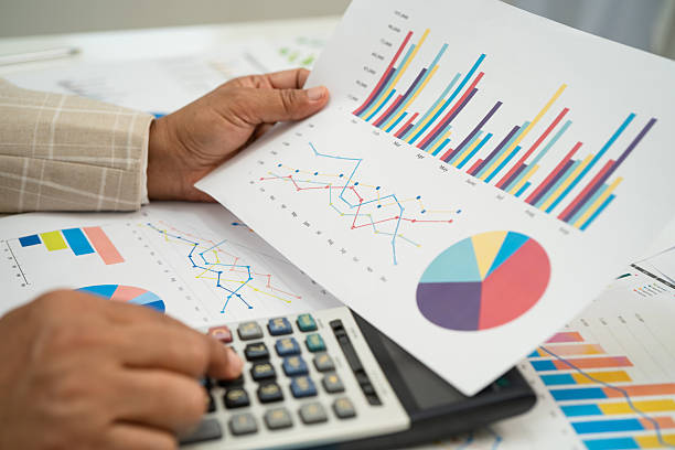 istock Asian business woman working with financial graph. 2231406824