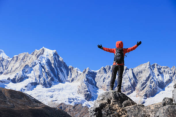 istock Backpacking woman hiking on high altitude mountain top 2231408392
