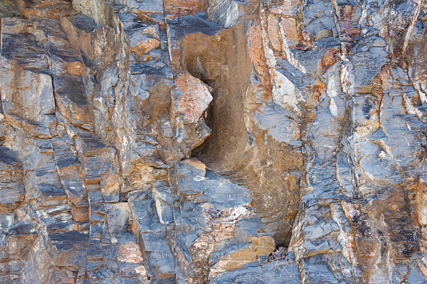 The rock layer broke in the cliff, background.