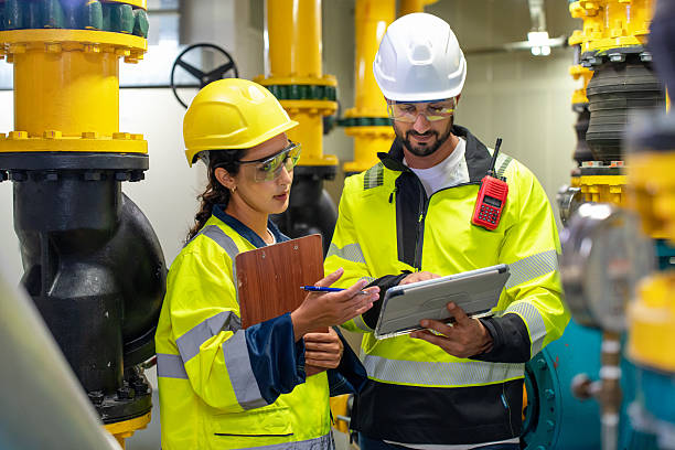 istock A man and woman engineer inspect a compressor and pipeline, focusing on infrastructure and production in a factory. 2231413615