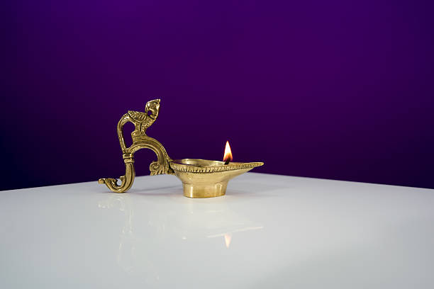 Oil lamp Diya burning during Diwali celebration.