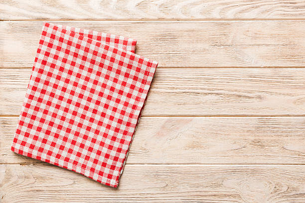 istock top view with red empty kitchen napkin isolated on table background. Folded cloth for mockup with copy space, Flat lay. Minimal style 2231420856