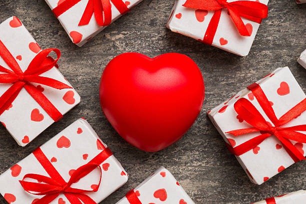 istock gift box with red bow and red heart on colored background . Top view. Flat lay 2231420896