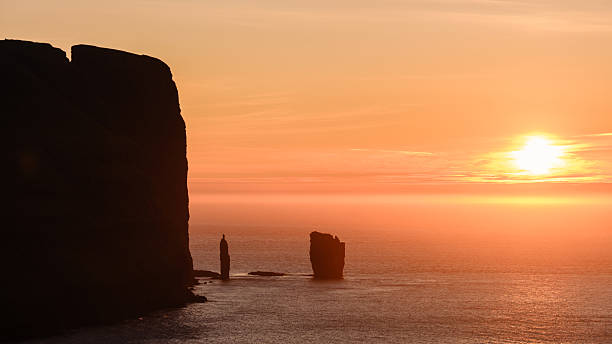 istock Majestic sunset over Risin og Kellingin rock formations in the Faroe Islands 2231421401