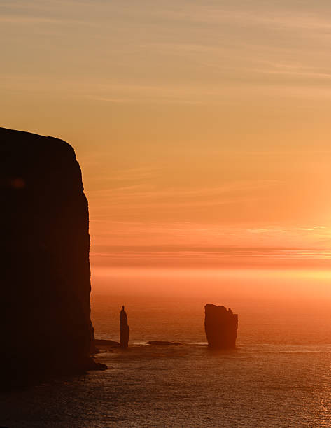 istock Majestic sunset over Risin og Kellingin in the Faroe Islands with dramatic cliffs 2231421406