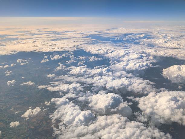 istock Beautiful cloudscape viewed from above during a daytime flight showcasing vast skies and diverse cloud formations 2231425772