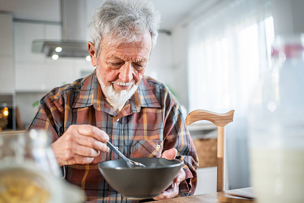 istock Senior man enjoying a healthy breakfast at home 2231427509