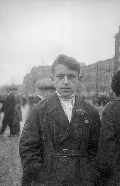 Leningrad, USSR - November 7, 1933: young man on demonstration dedicated to Great October Socialist Revolution