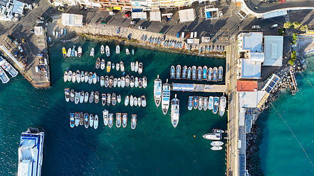 istock Vibrant harbor filled with colorful boats under bright sunlight capturing a lively waterfront atmosphere in an idyllic coastal town 2231434163