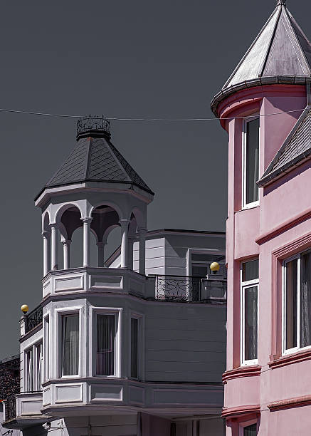 istock Pink and White Vintage Building with Turrets 2231435330