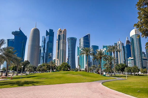 istock Tall modern skyscrapers tower over central park in Doha Qatar. 2231438361