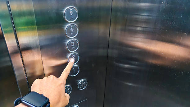 istock Cropped Hand Of Man Pressing Push Button in Elevator 2231439346