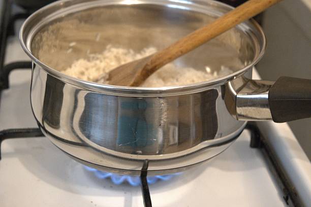 istock Rice in Pot with Oil on Stove 2231442153