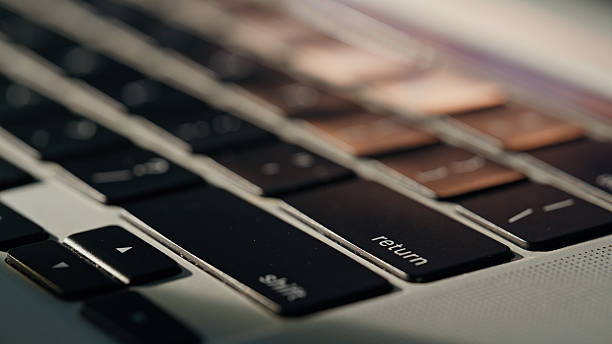 Closeup hands pressing button typing laptop. Manager person finishing work project. Unrecognizable man customer shopping online using computer at home office. Freelancer journalist touching keyboard