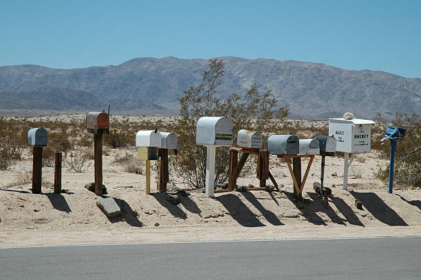 Desert row of mailboxes under a bright sky, USA West, August 2007
