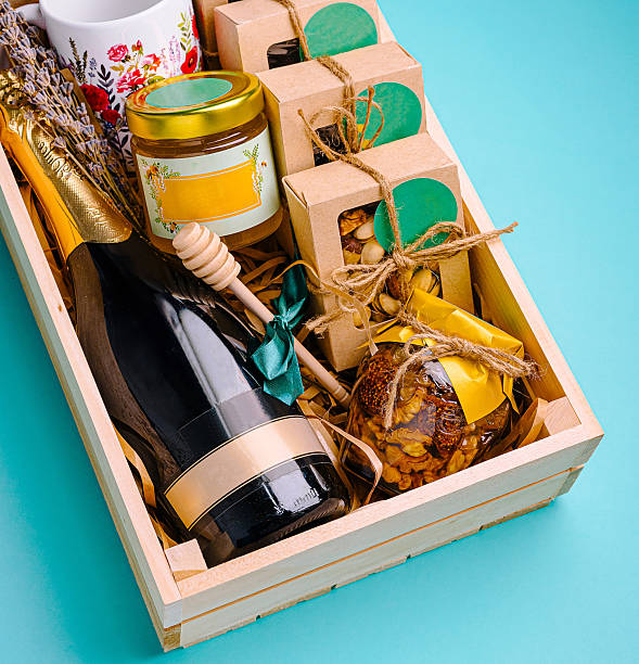 istock Gift basket with champagne, snacks, and decorative items for celebrations 2231446766