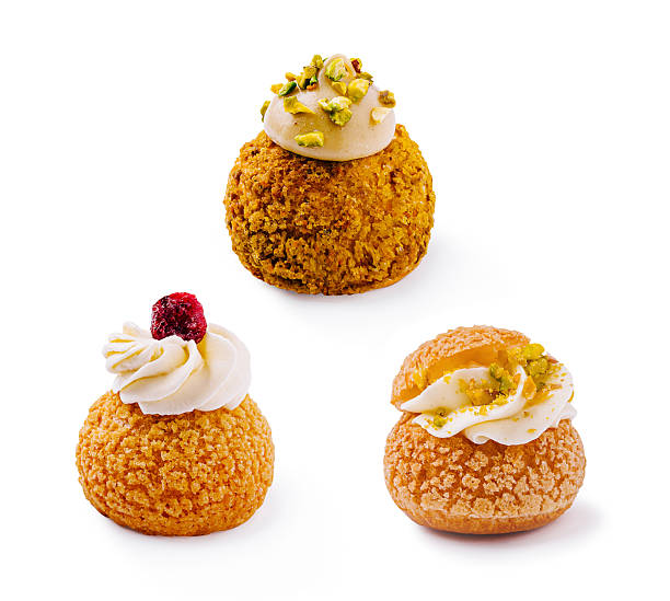 istock Delicious cream-filled pastries displayed on a clean white background 2231447599