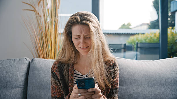 istock Stressed Woman Looking at Smartphone and Feeling Frustrated 2231448539