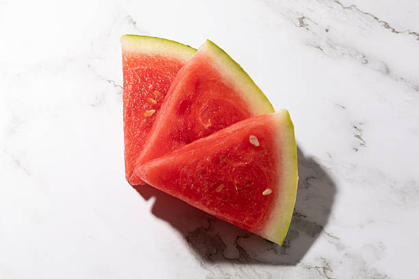istock Slices of watermelon isolated on kitchen countertop background 2231449043