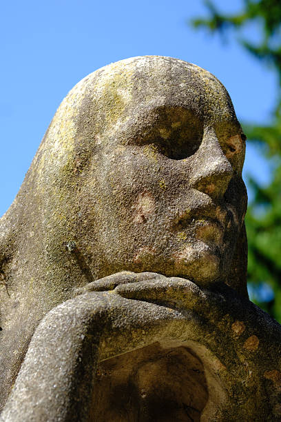 Egyptian Sphinx Monument Statue in a cemetery.