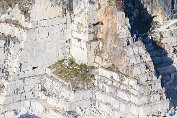 Colonnata di Carrara, Italy - August 08, 2024: marble extraction in Carrara marble quarry, the same marble of the David by Michelangelo